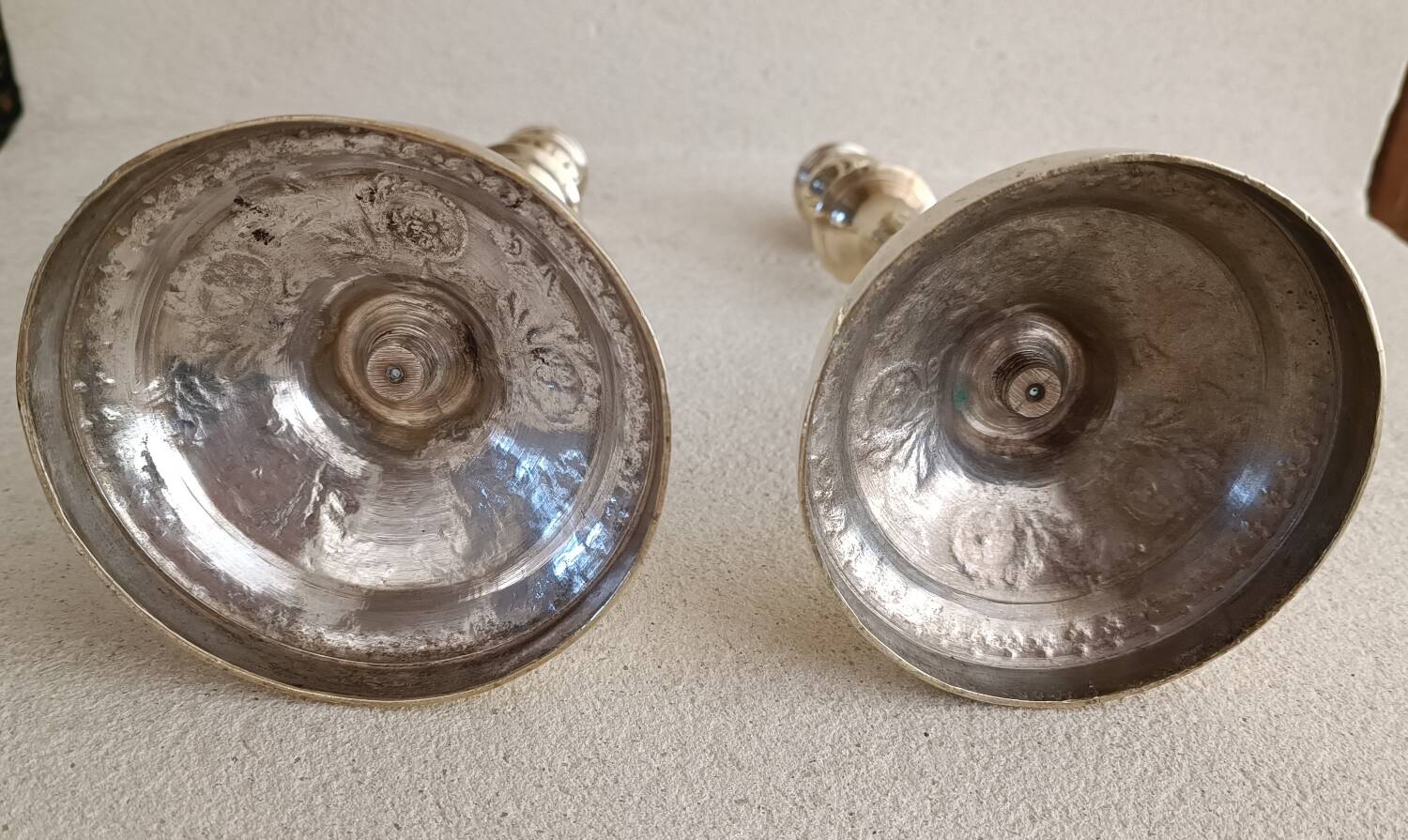 Pair of chiseled brass candlesticks