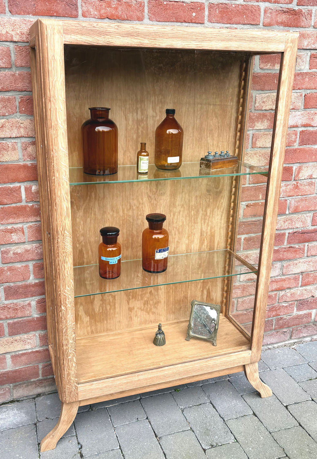 Restored antique oak display cabinet with glass shelves.