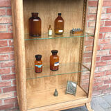 Restored antique oak display cabinet with glass shelves.