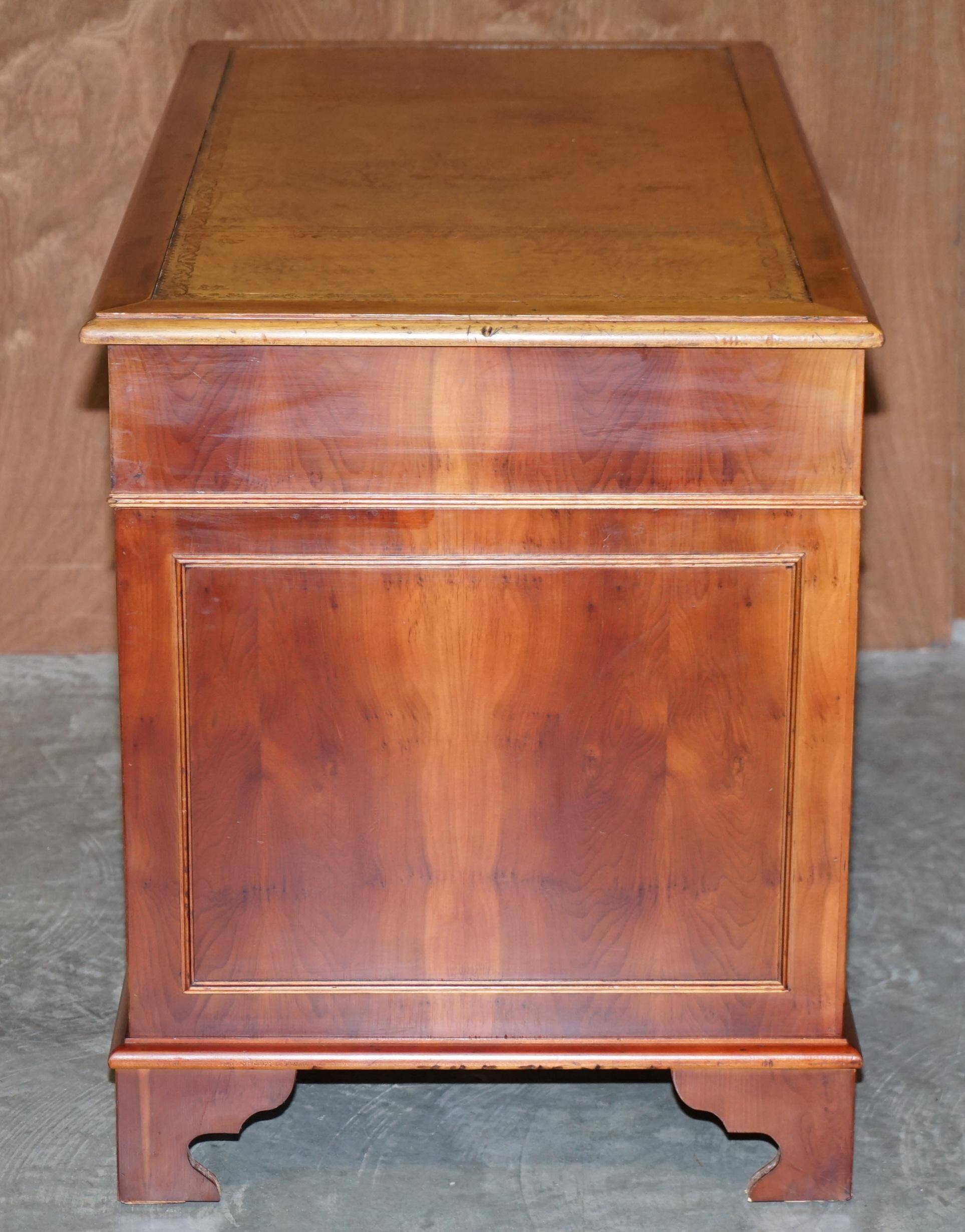 Vintage walnut desk with a leather top and two drawers.