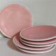 Six old pink earthenware dessert plates
