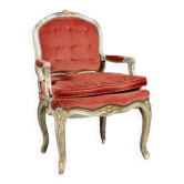 Louis XV style armchair in molded and carved wood with gray and gold patina