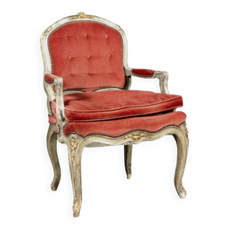 Louis XV style armchair in molded and carved wood with gray and gold patina