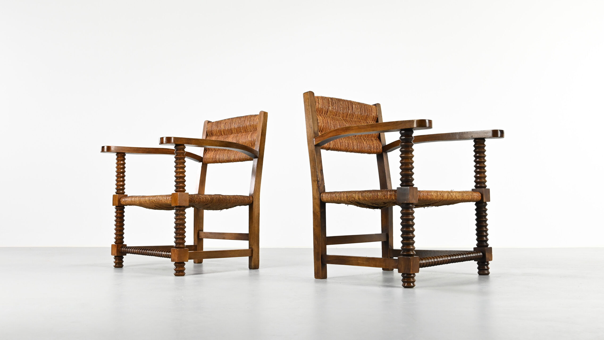 Pair of French armchairs with twisted legs in the style of Charles Dudouyt, France, 1940s.