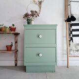 Old chest of drawers with two green drawers