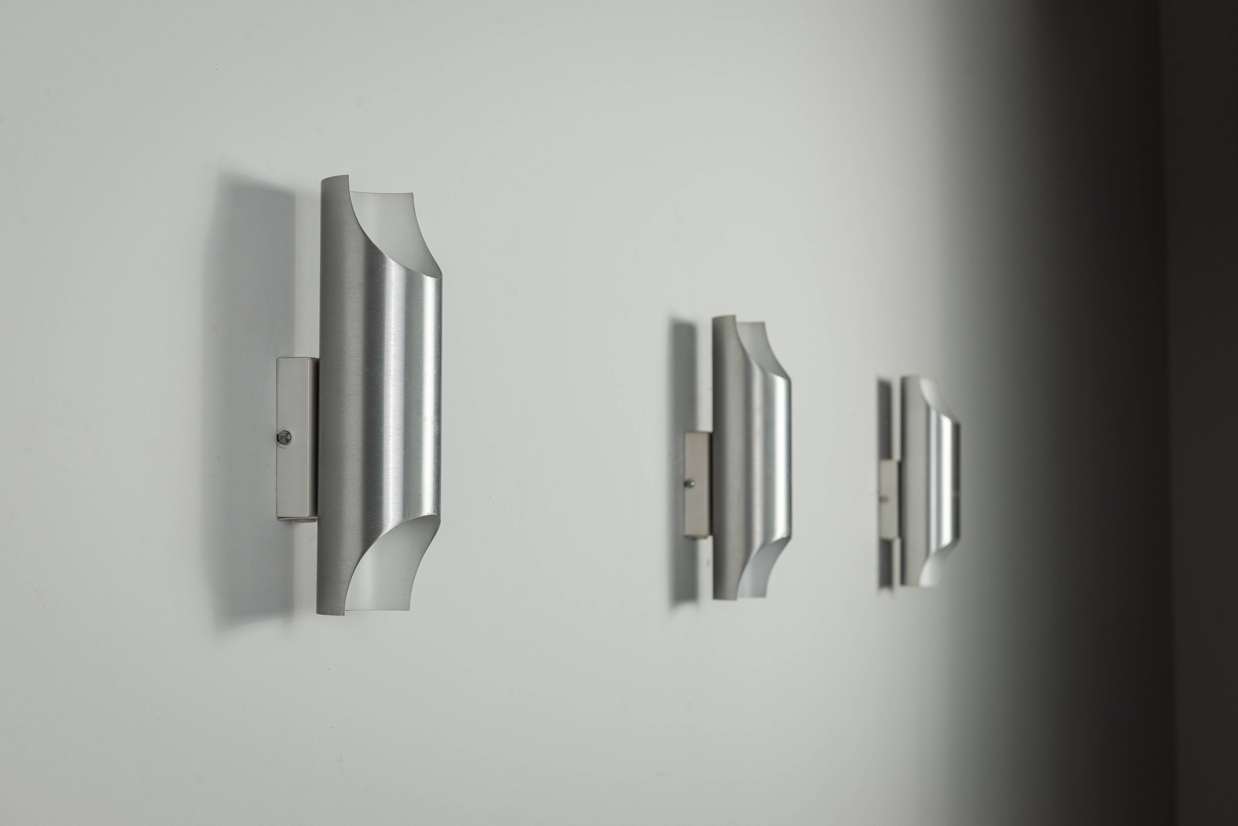 Set of three aluminium cylindrical wall lamps