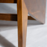 Reclined armchair in canned teak in natural wood