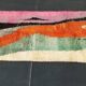 Large handmade Moroccan rug with colourful patterns.