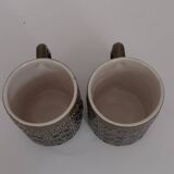 Duo of BP 70's slip mugs