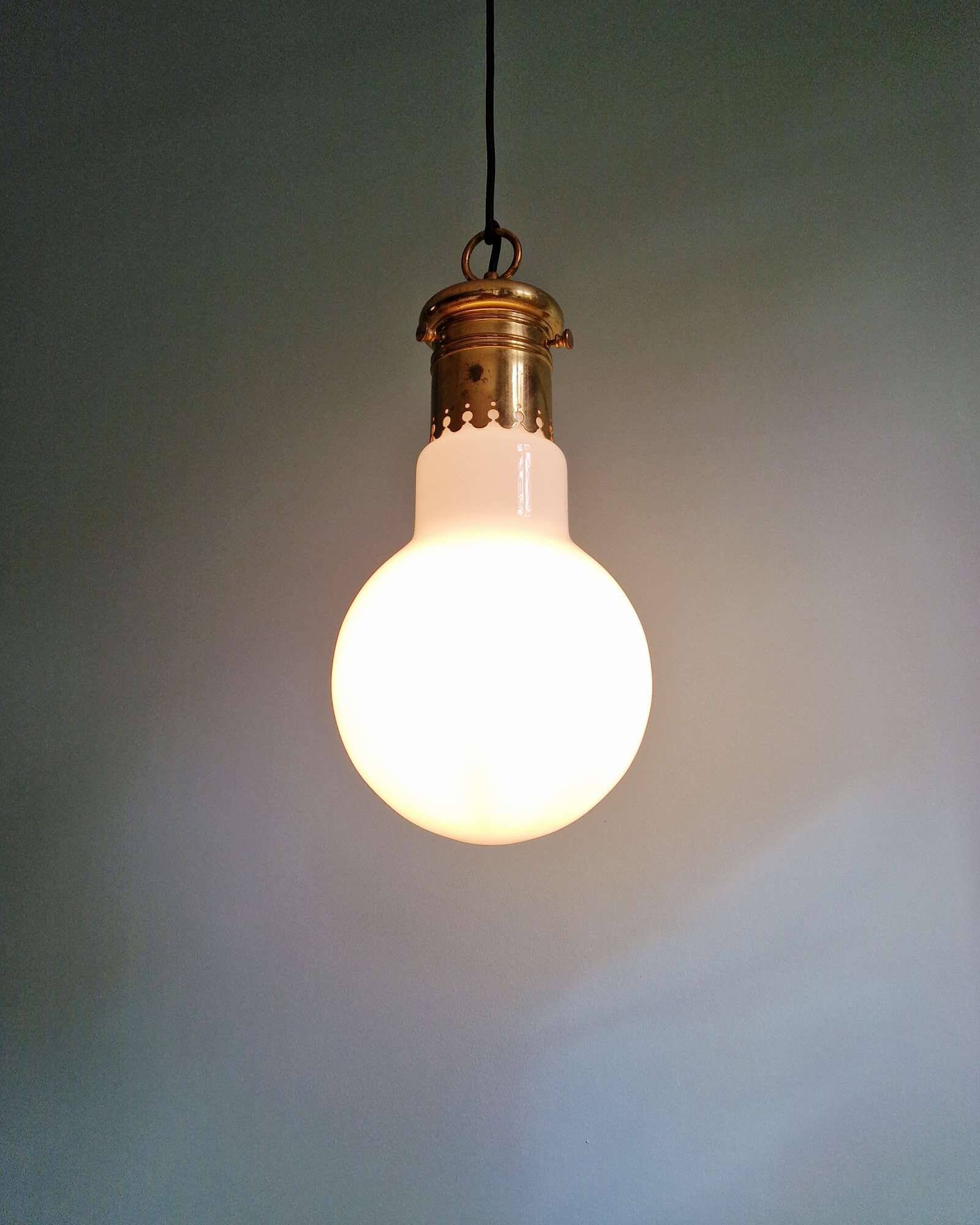 Large bulbous pendant light in white opaline and brass