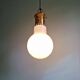 Large bulbous pendant light in white opaline and brass