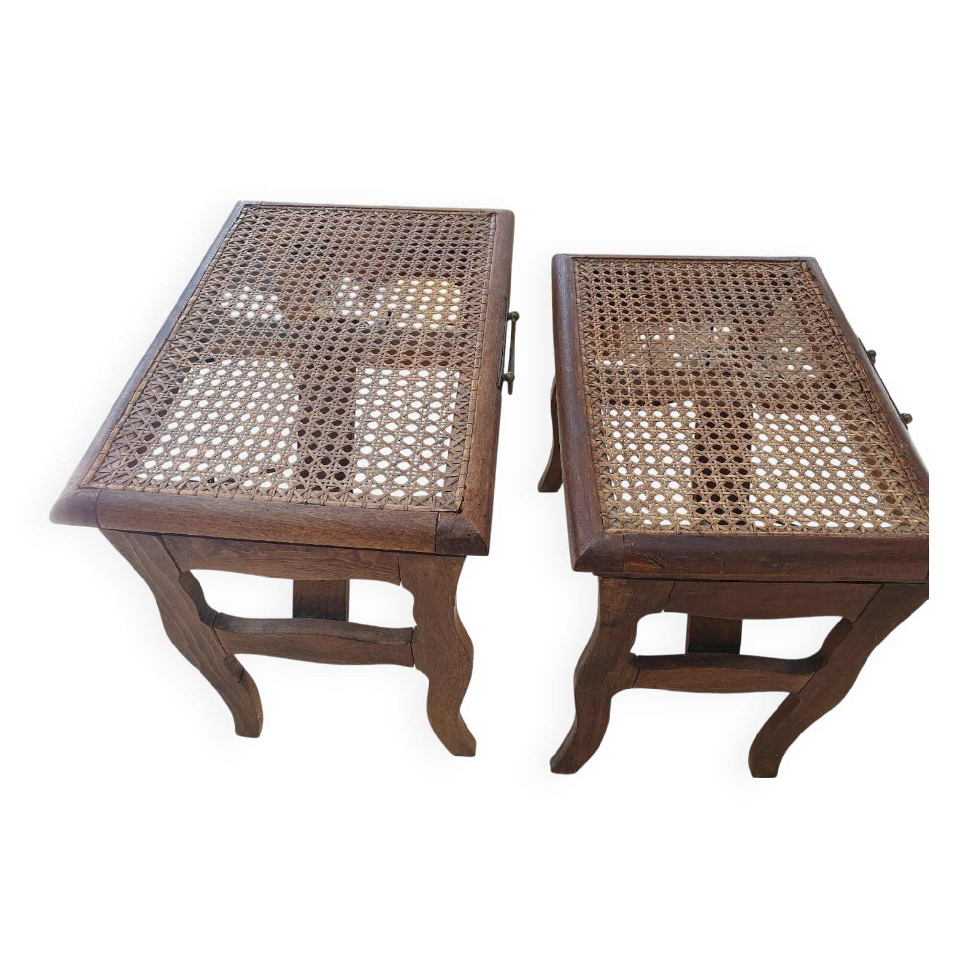 Two folding stools with caned seats.