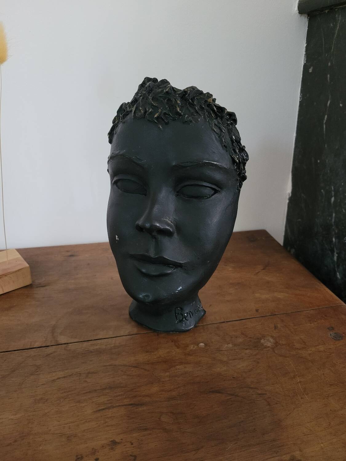 Black ceramic face sculpture