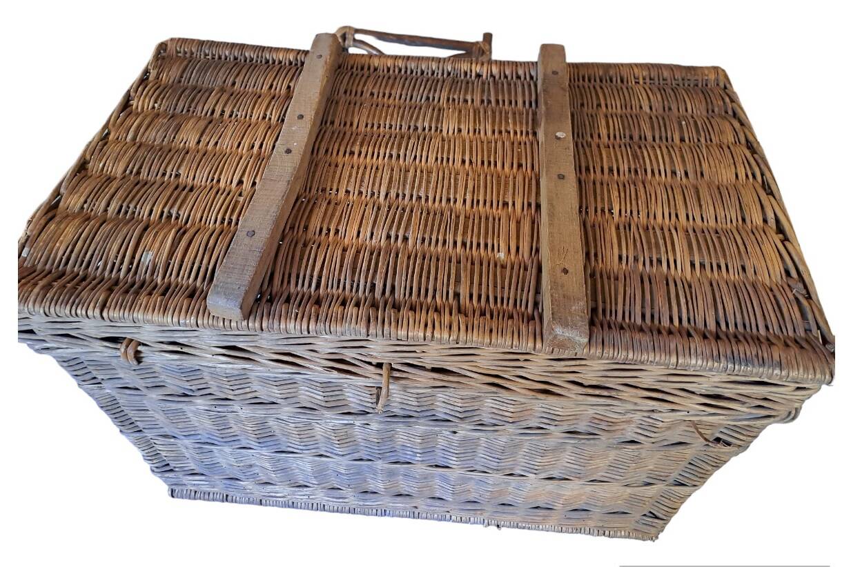 Wicker travel trunk XIX with metal clasps and handles.
