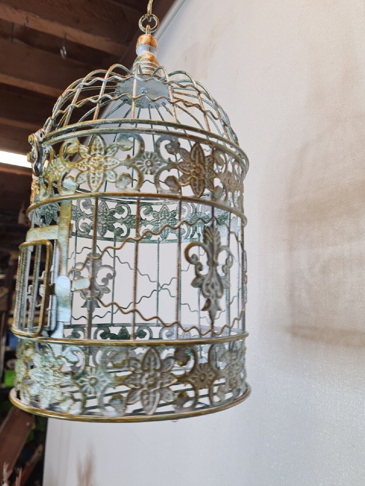 Round weathered iron birdcage