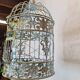 Round weathered iron birdcage