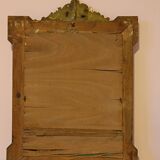 Miroir Napoléon III a riche ornementation dorée