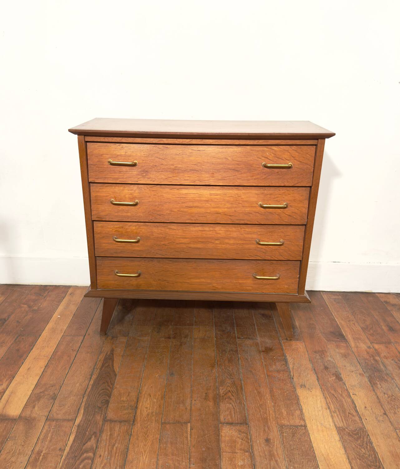 Chest of drawers with compass feet and gold handles