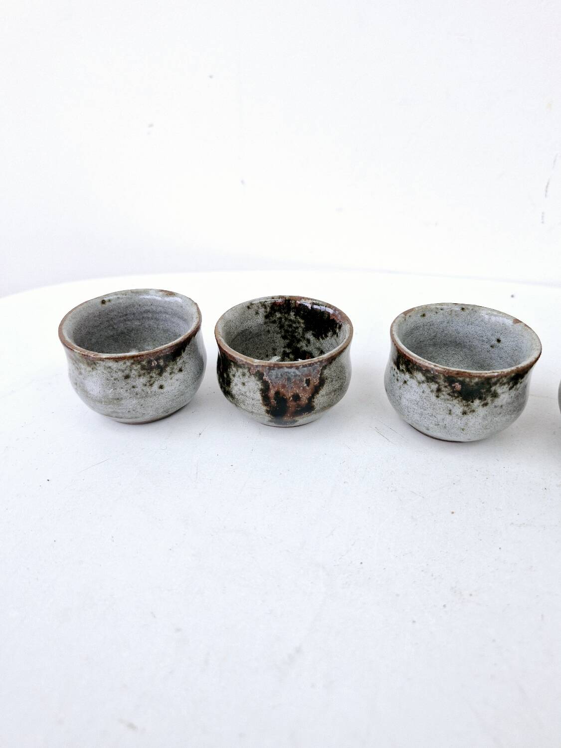 Vintage enameled stoneware service with 6 small bowls and a sugar bowl or sauce bowl