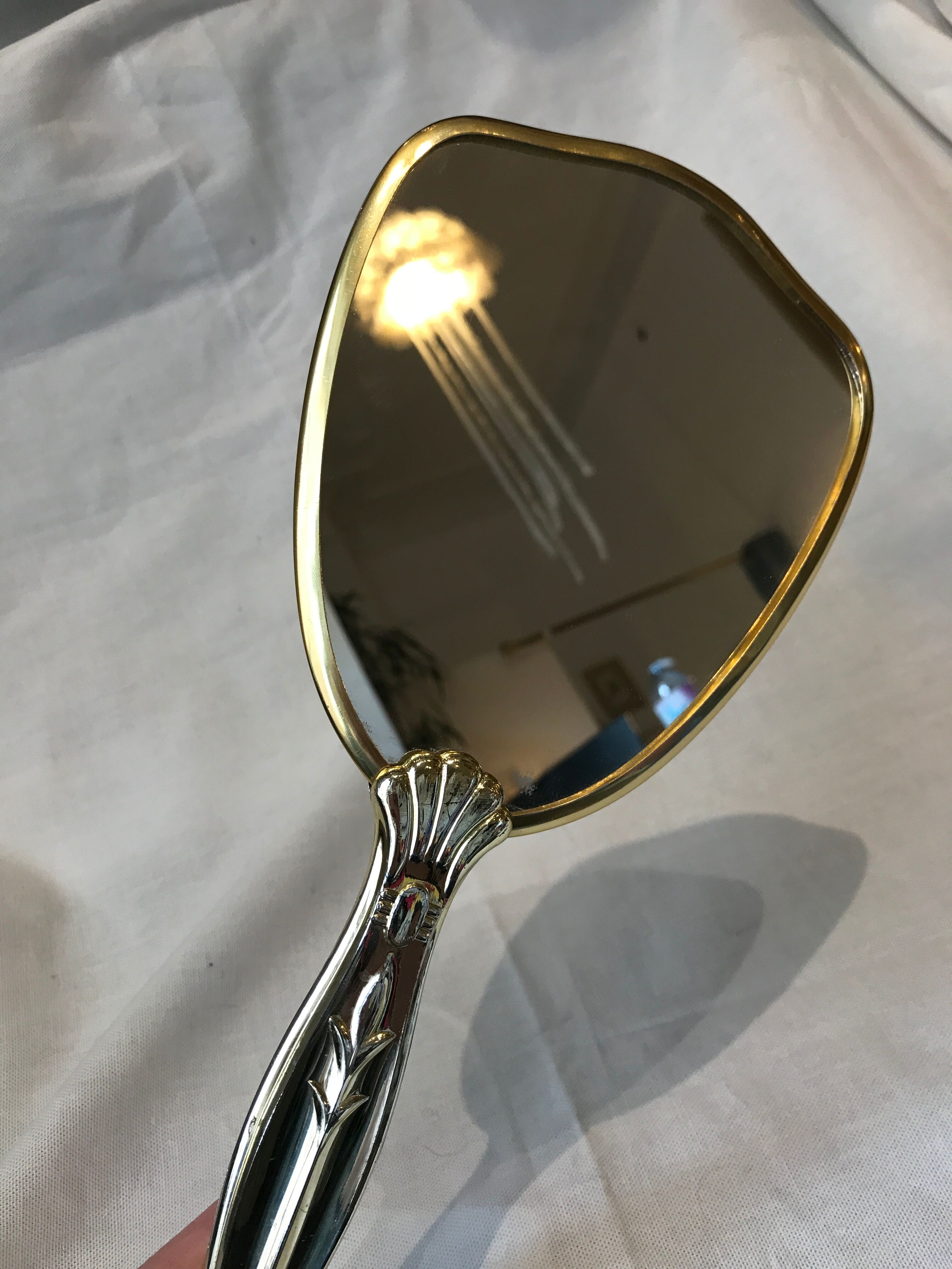 Hand-faced mirror