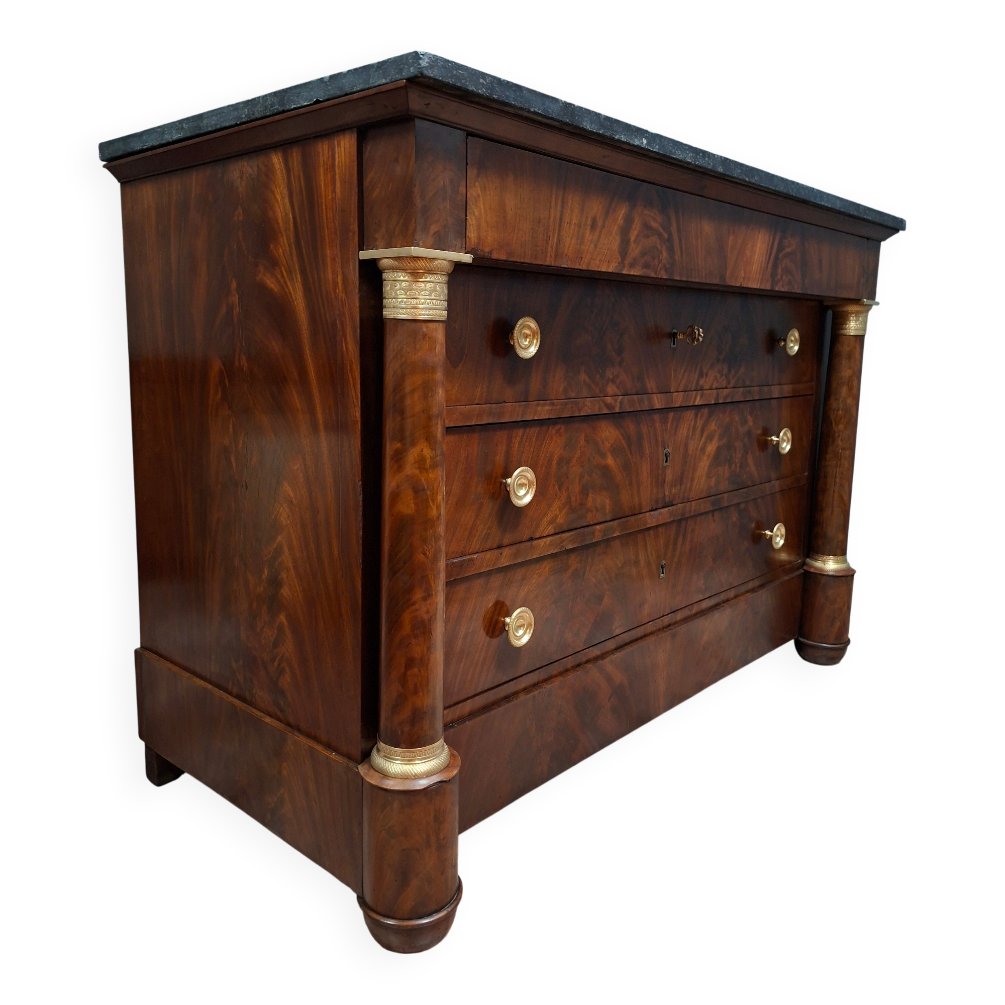Empire commode in mahogany and flame mahogany veneer, 19th century.