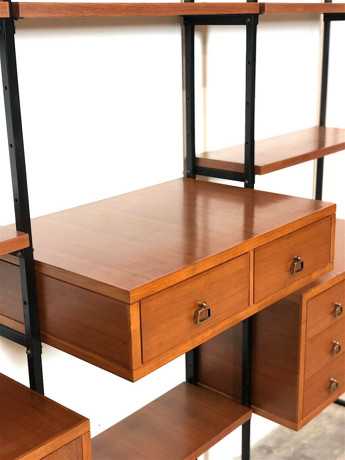 Modular storage unit and teak bookcase. Italy, 60s