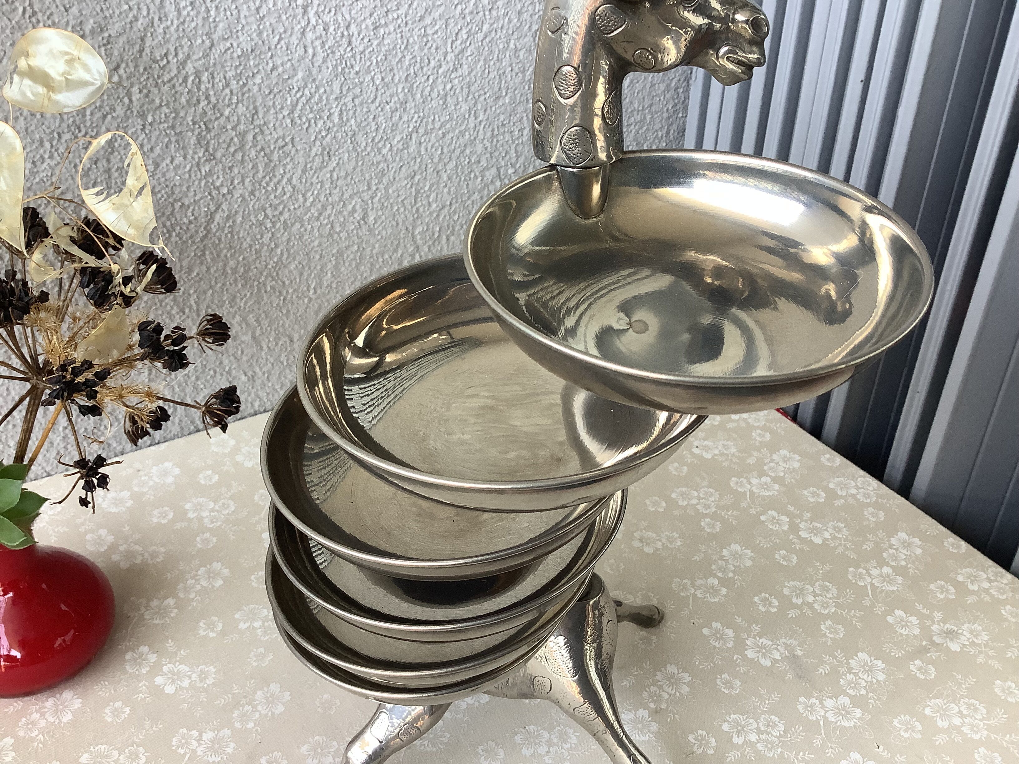 Bronze giraffe and silver metal servant