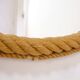 Large oval mirror in rope with pediment, 64cm x 56.5cm.