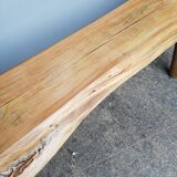 Big bench in solid rough wood very thick Brutalism