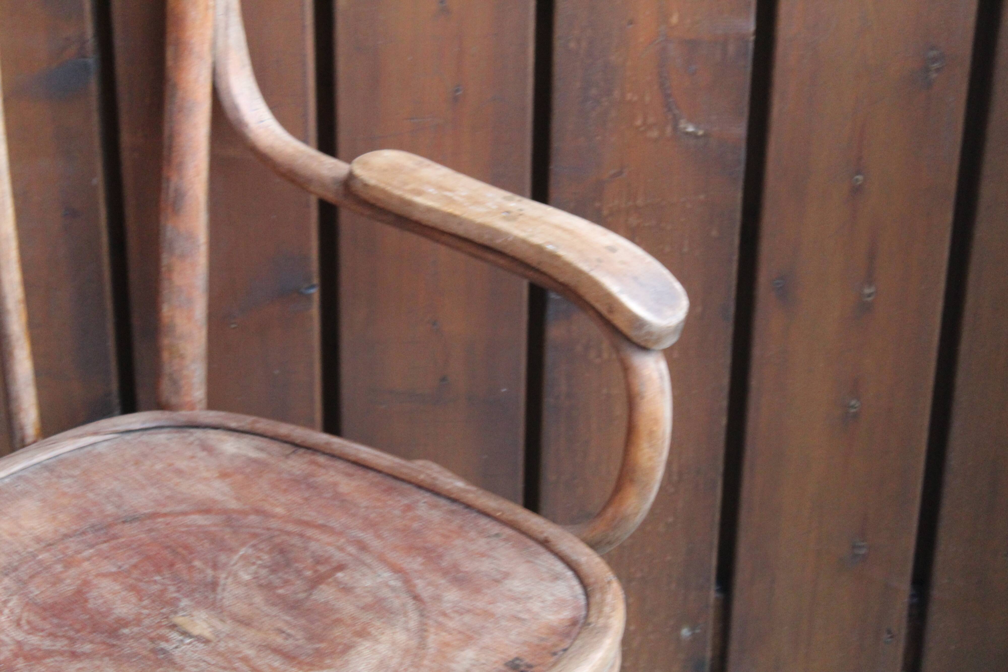 Curved wooden armchair