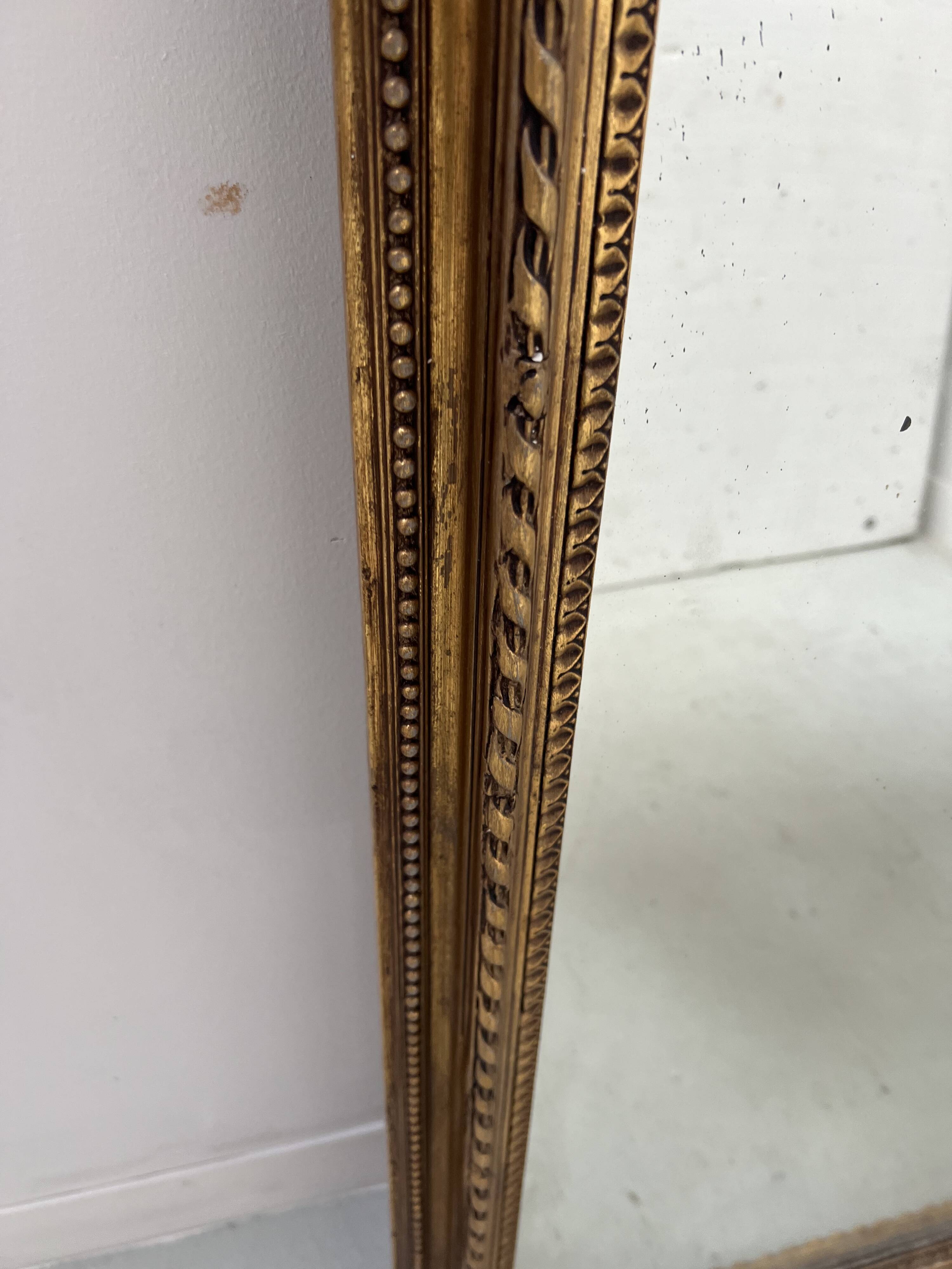 Louis XVI style mirror in wood and gilded stucco, 19th century