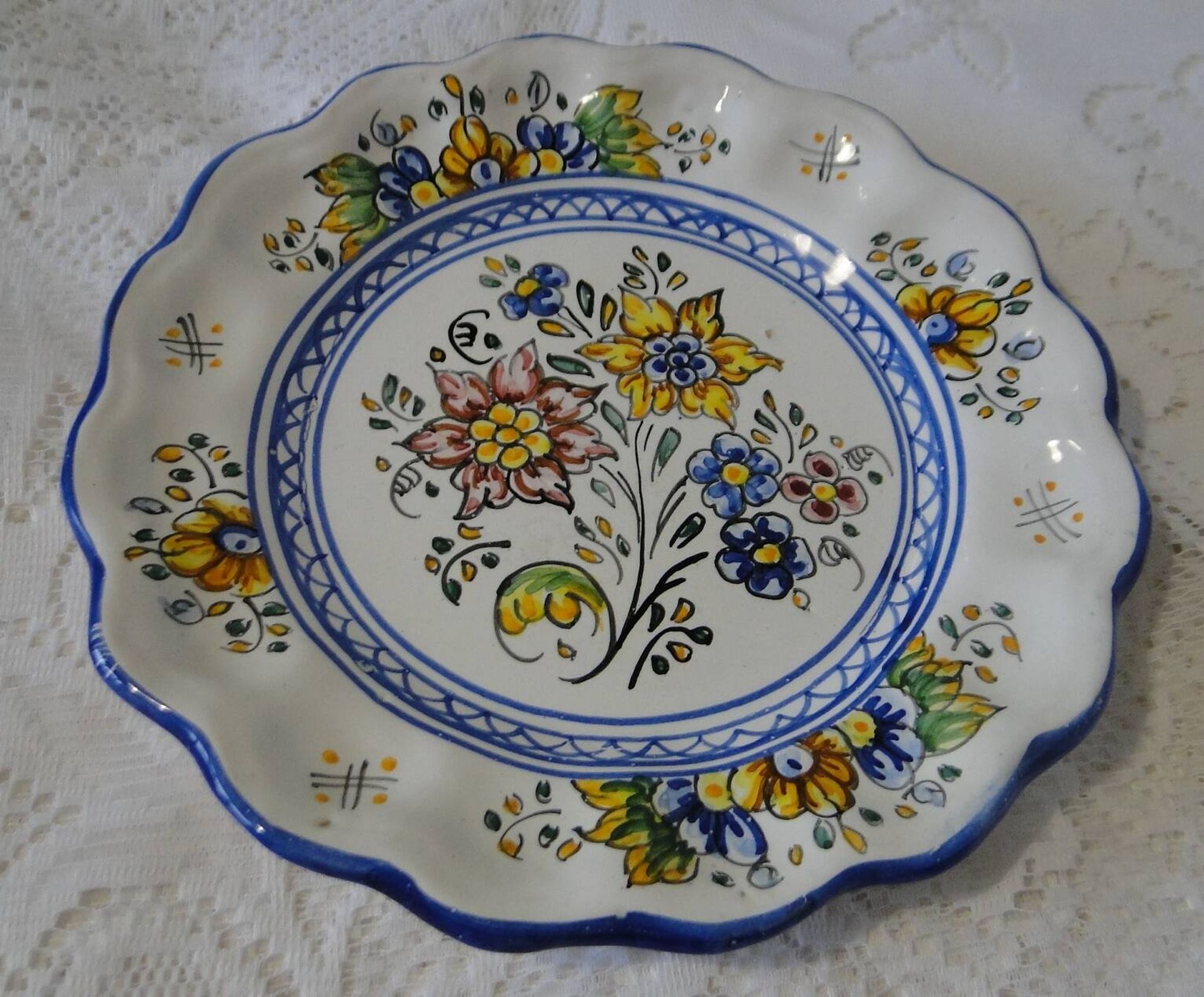 Decorative earthenware plate with floral Talavera decoration