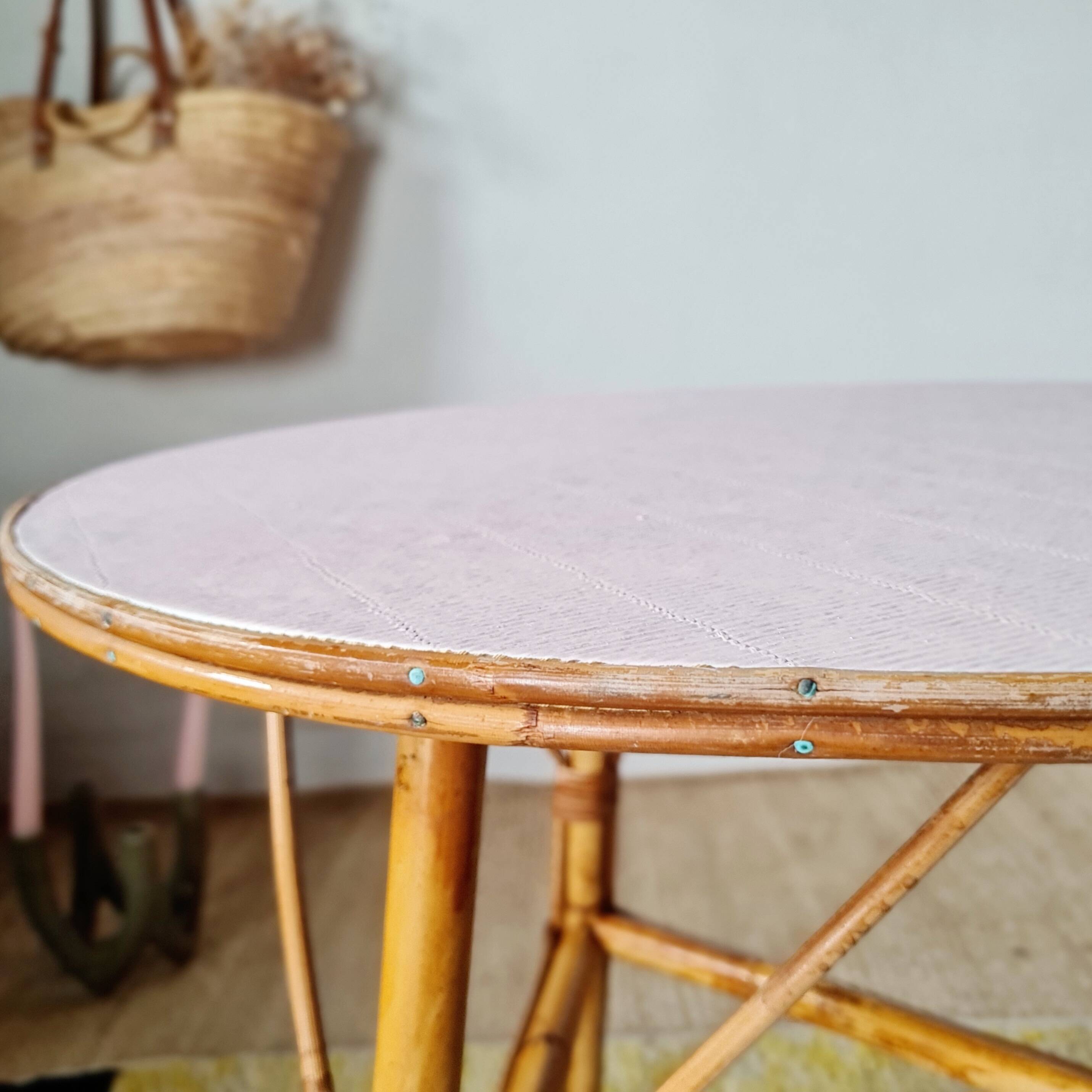 Round soft pink rattan table