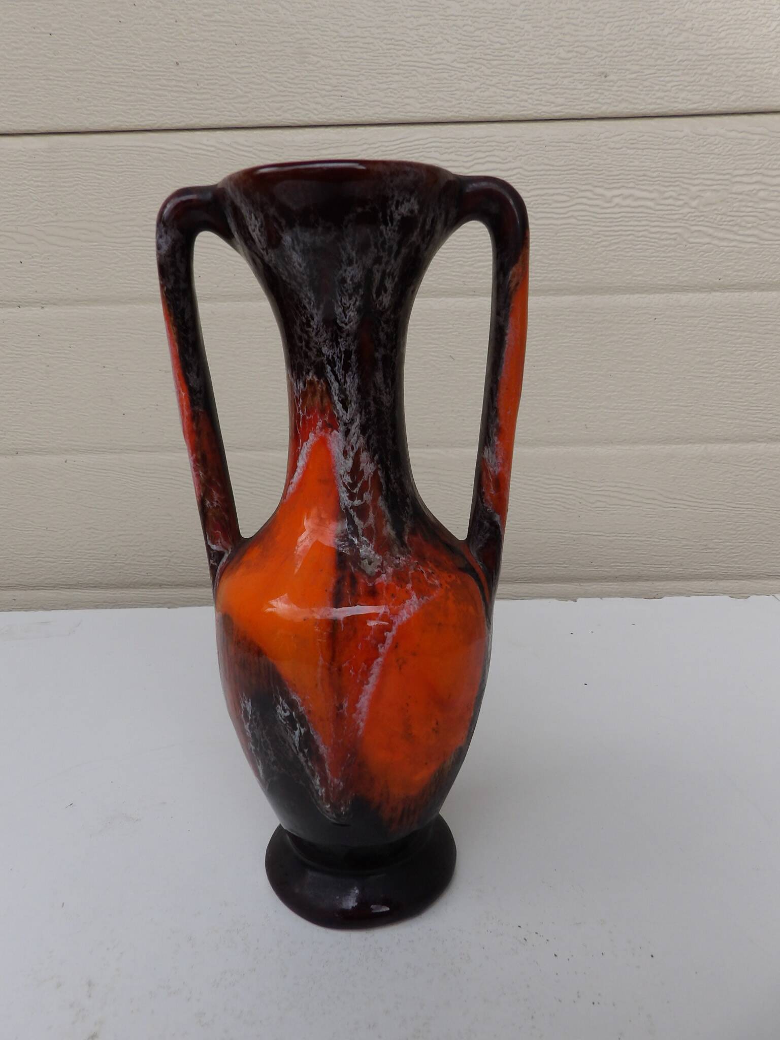 Vase with two orange handles