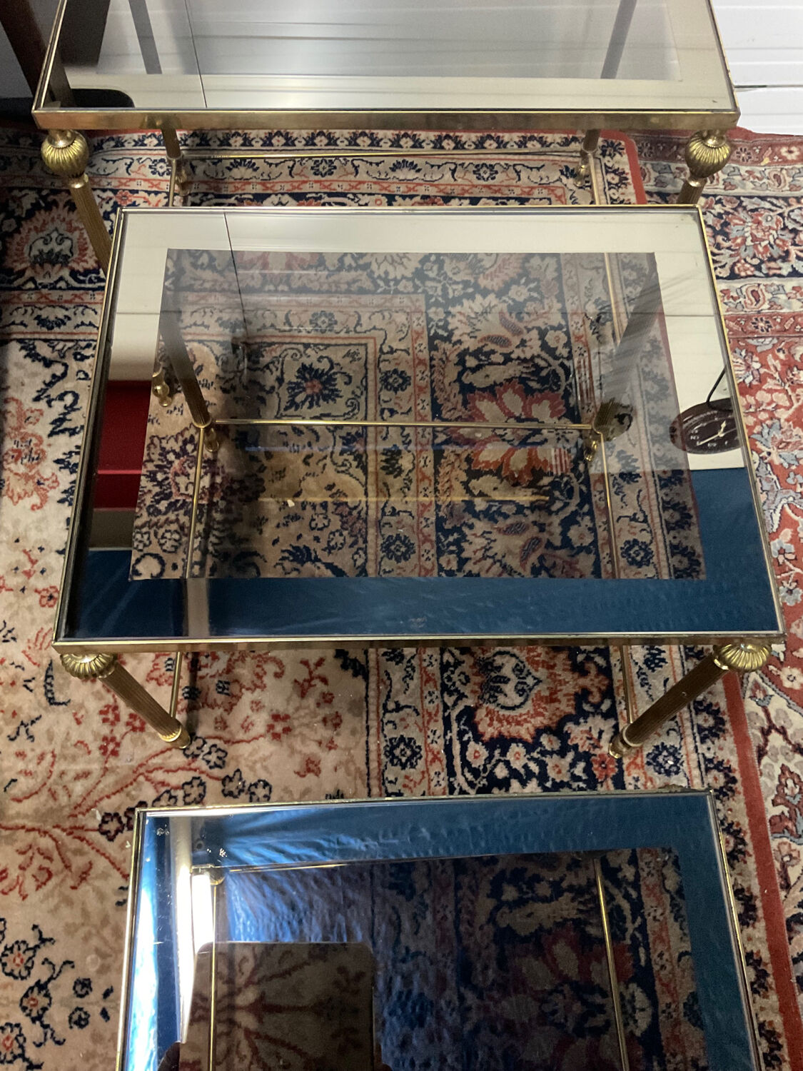 Series of 3 empire style nesting tables in brass and glass