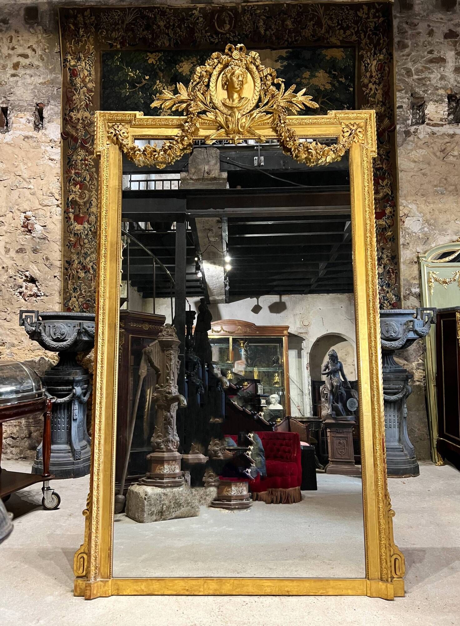 Monumental mirror Napoleon III in gilded wood with the profile of Apollo