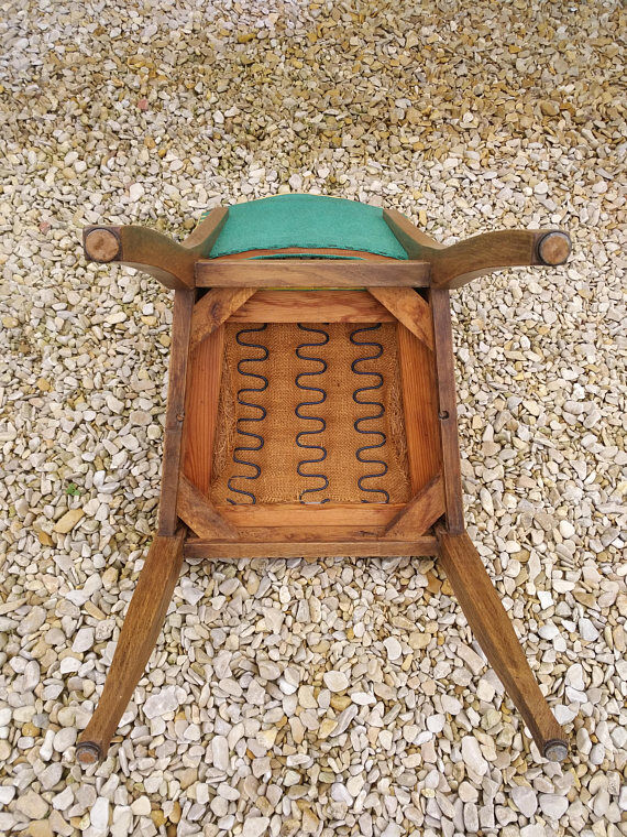Skai vintage and sitting Chair wood and springs.