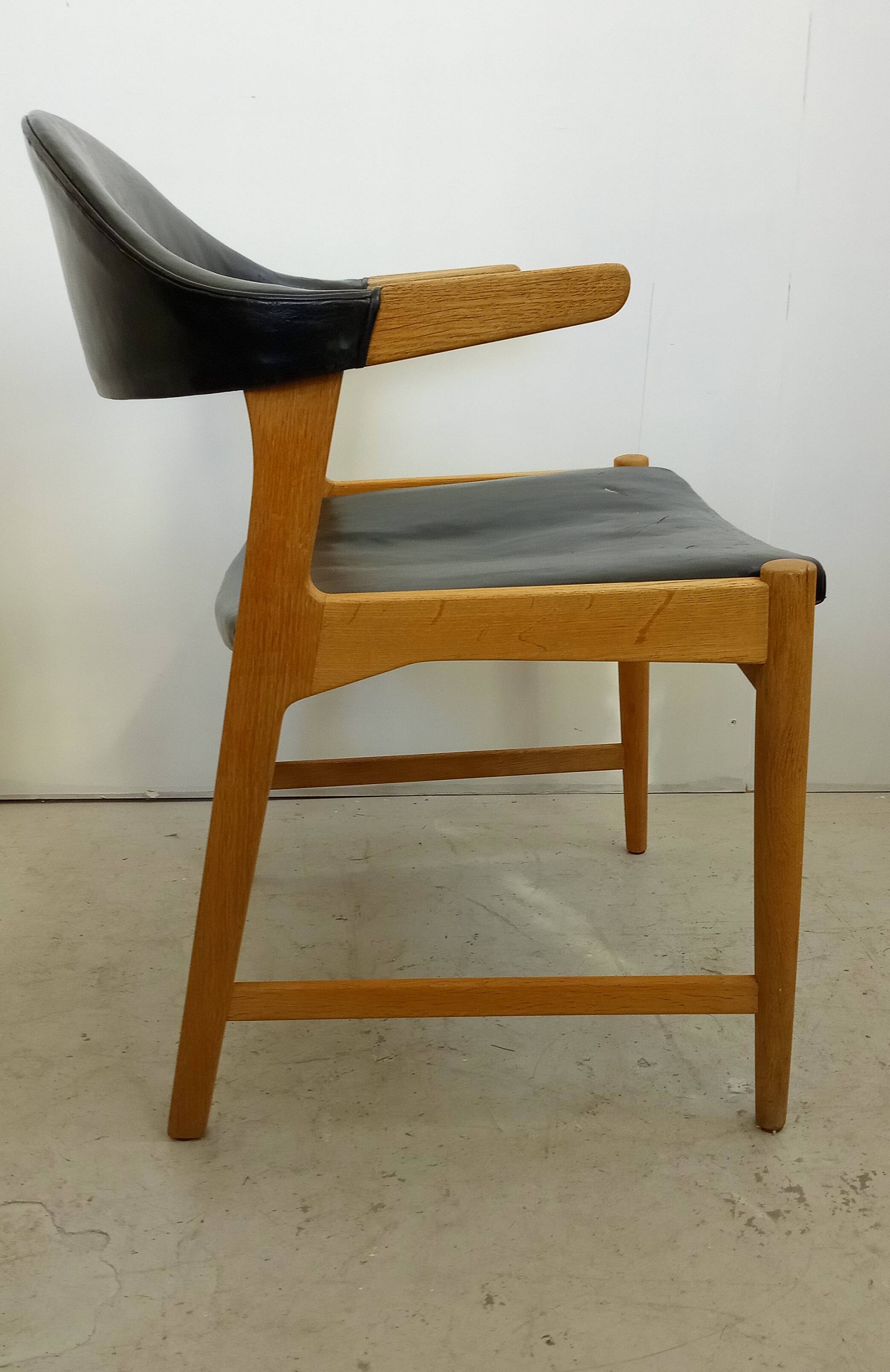 Danish armchair in oak and black leather