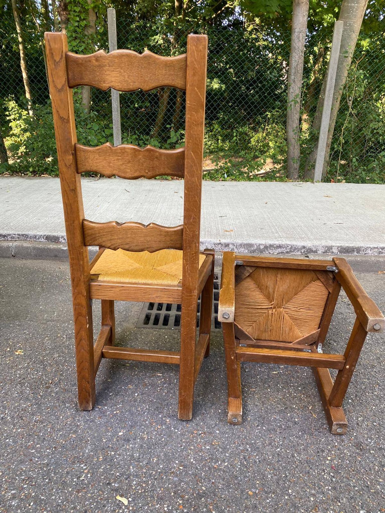 8 wooden dining chairs with straw seats, farmhouse style, high back.