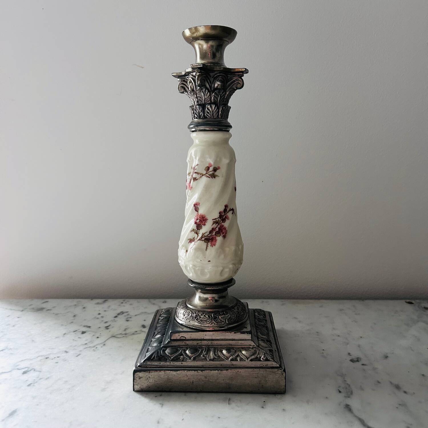Silver-plated metal and porcelain candlestick