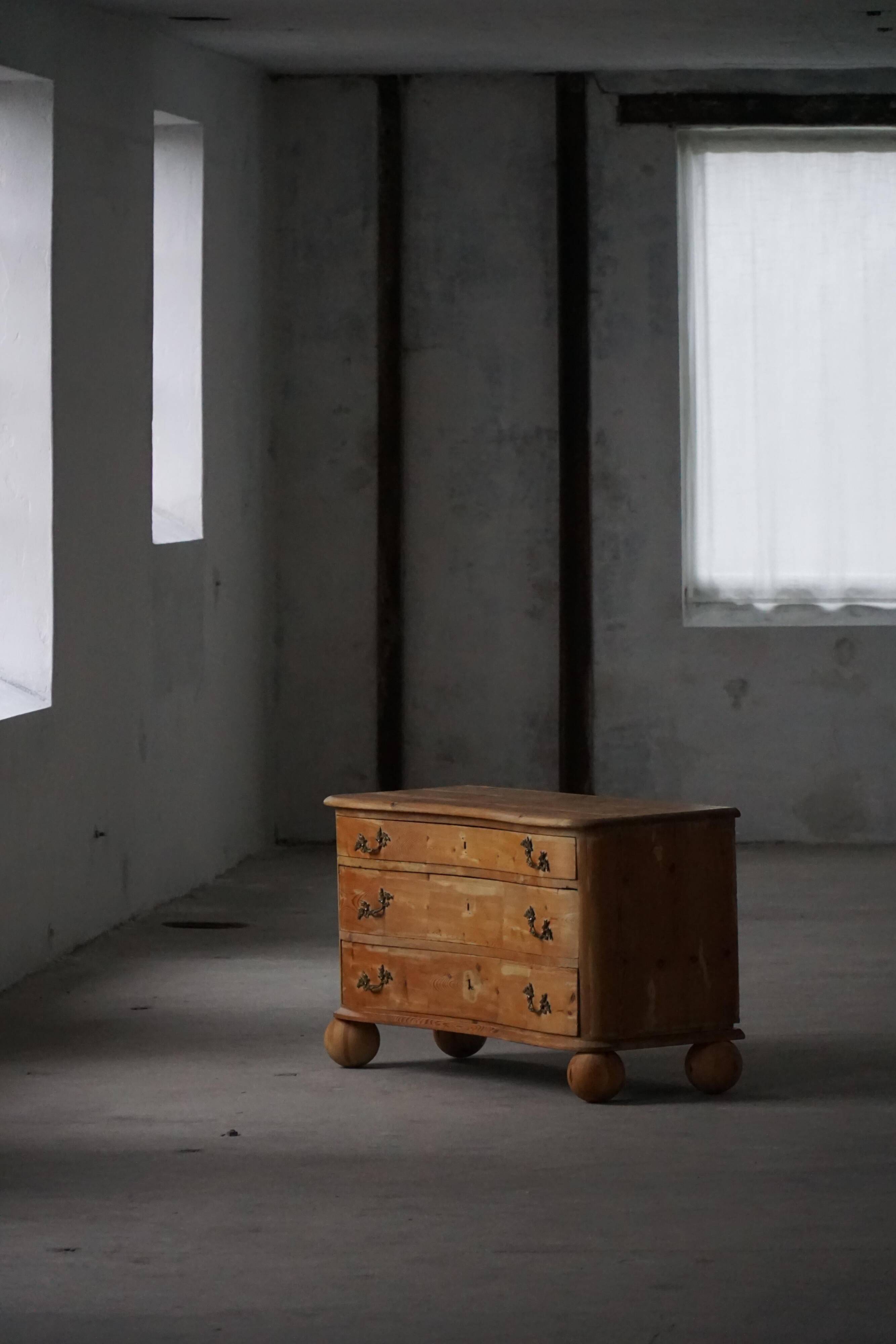 Antique Danish pine commode with ball feet, late 19th century.