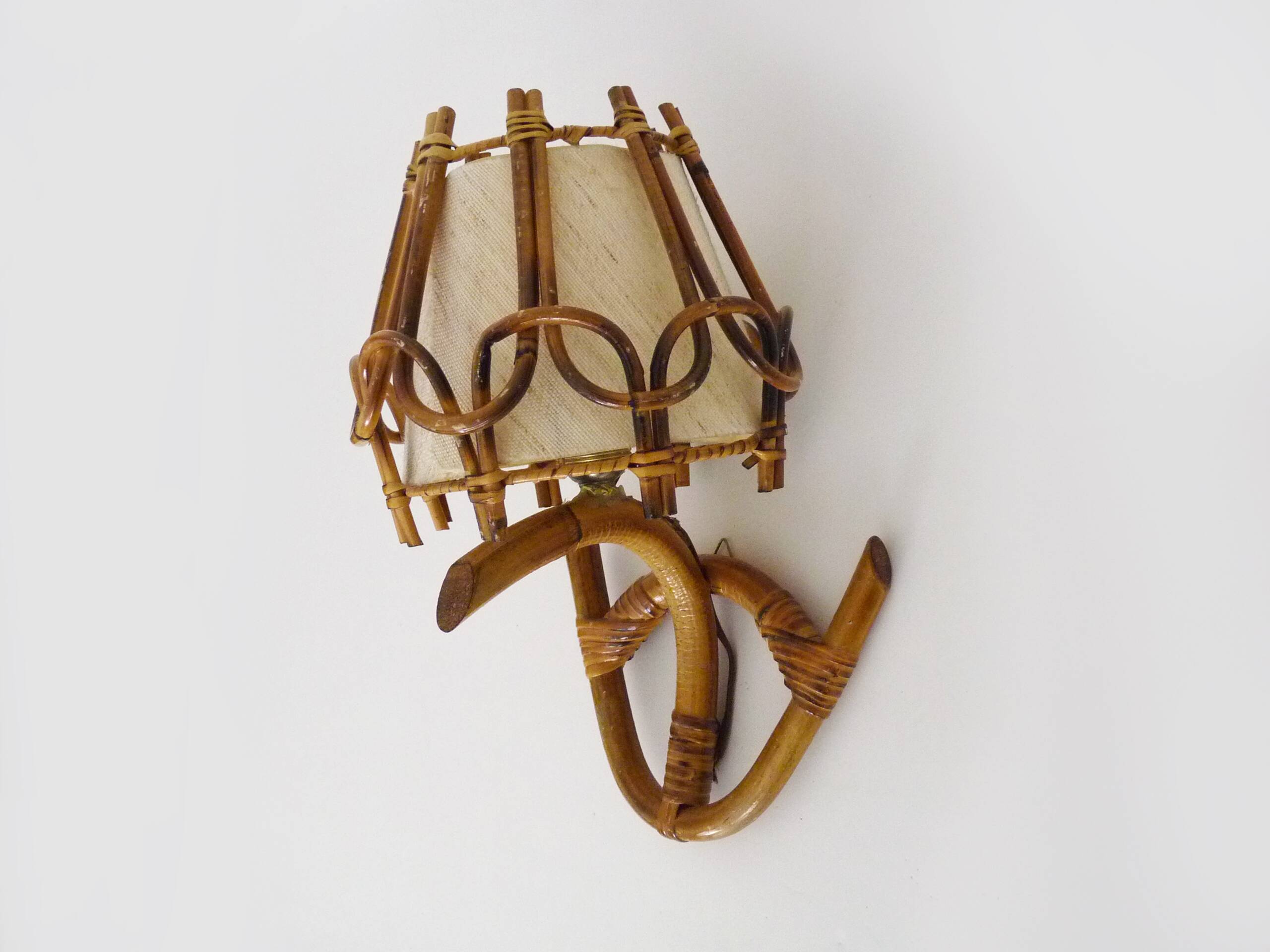 Louis Sognot rattan and bamboo wall light. 1950s