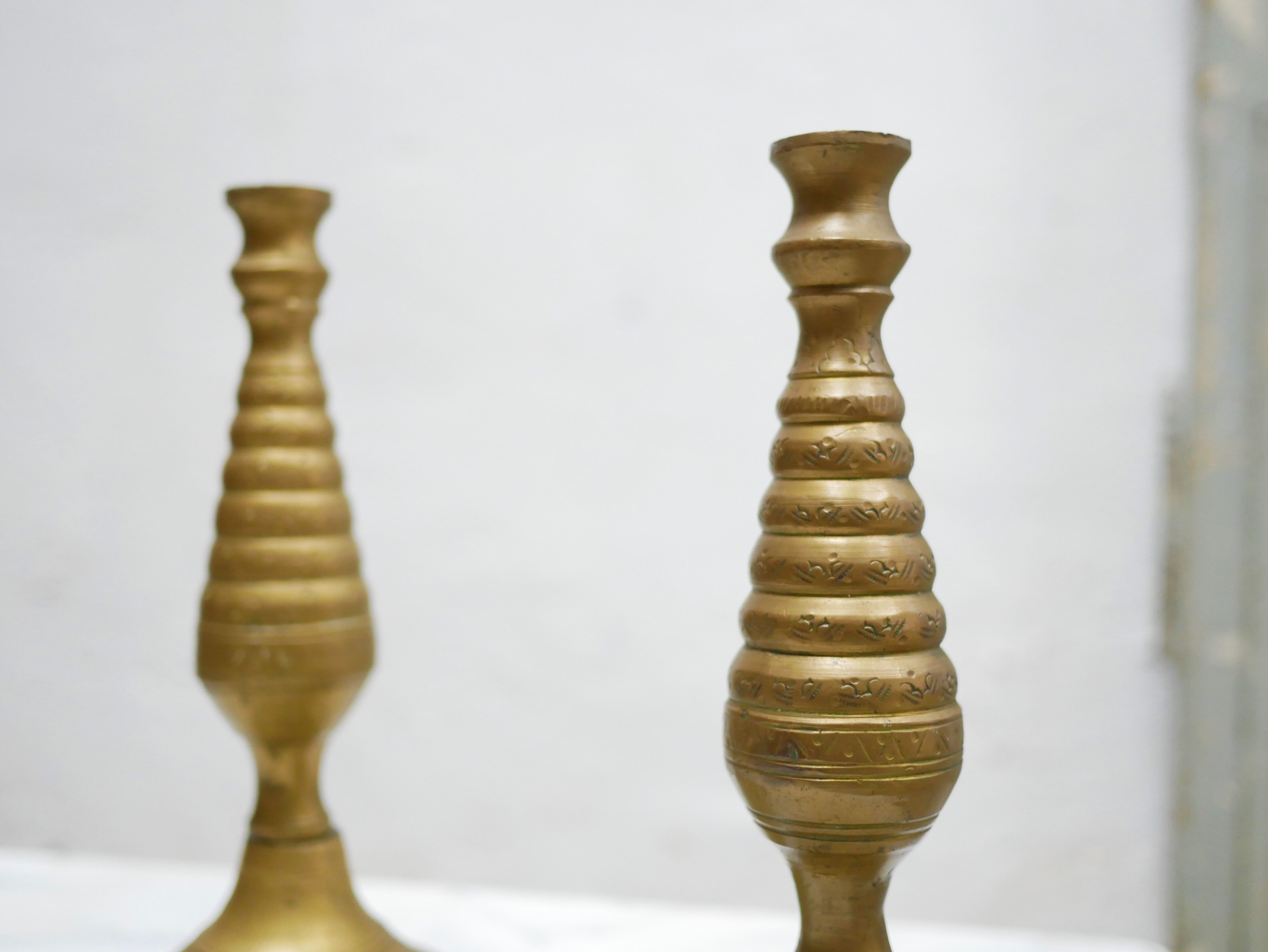 Pair of vintage candle holders in golden brass