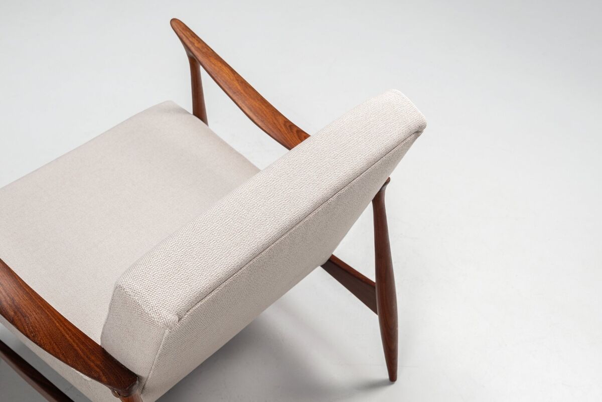 Sculptural Danish lounge chair in teak and fabric Denmark 1960