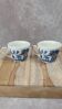 Set of 2 English cups with blue Willow style decoration.