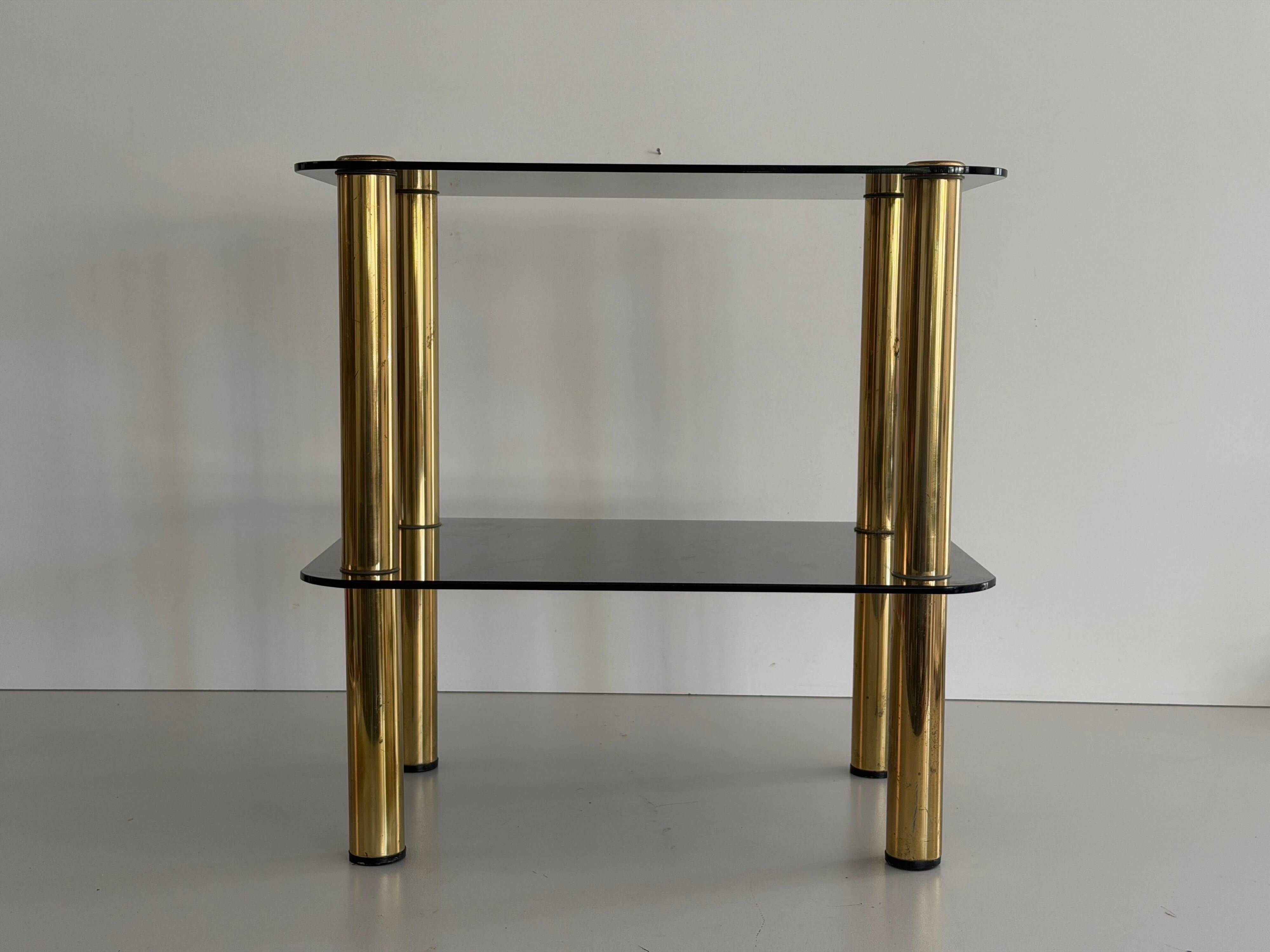Side table in thick greenish glass with brass legs, Italy, 1960s.