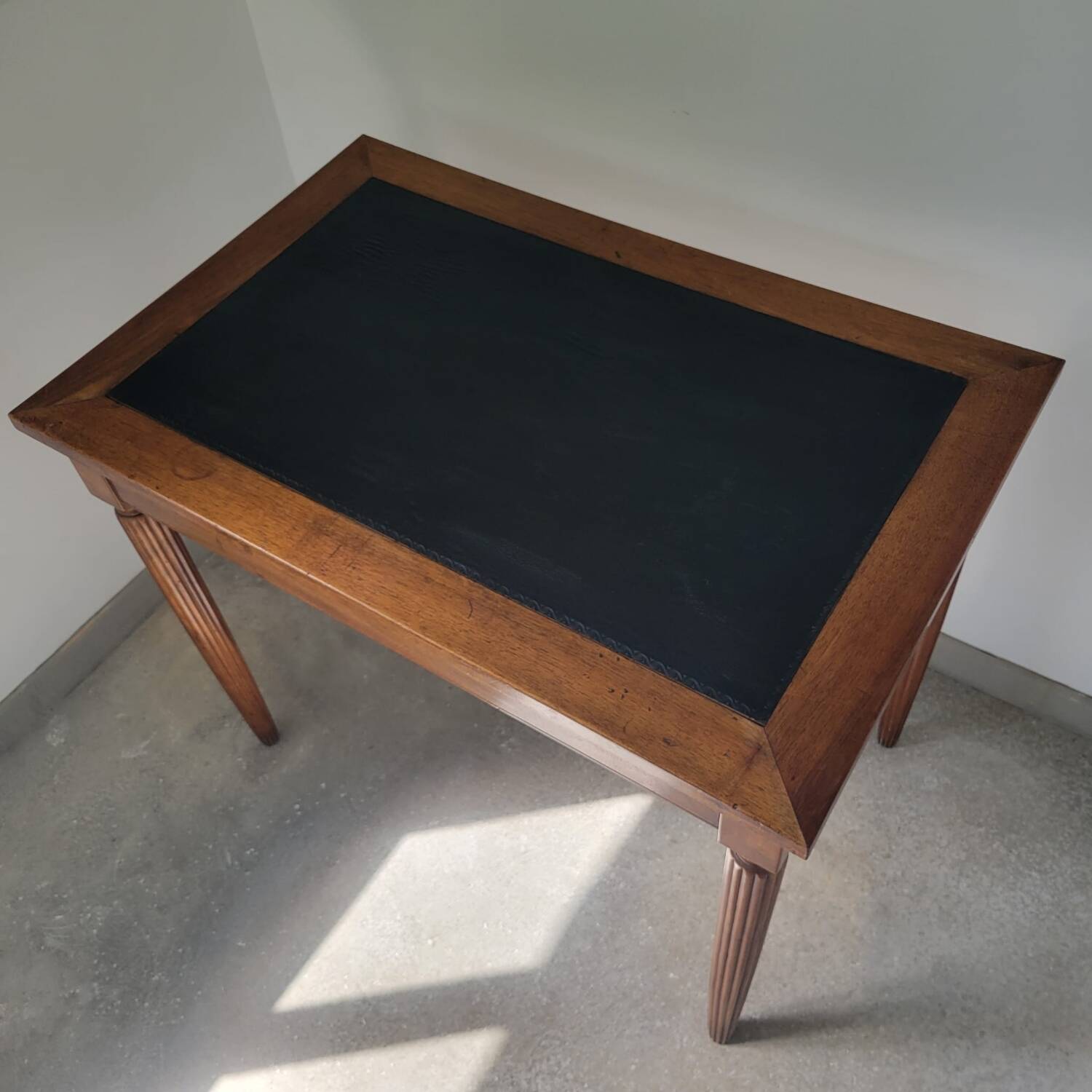 Antique desk made of solid wood and leather.