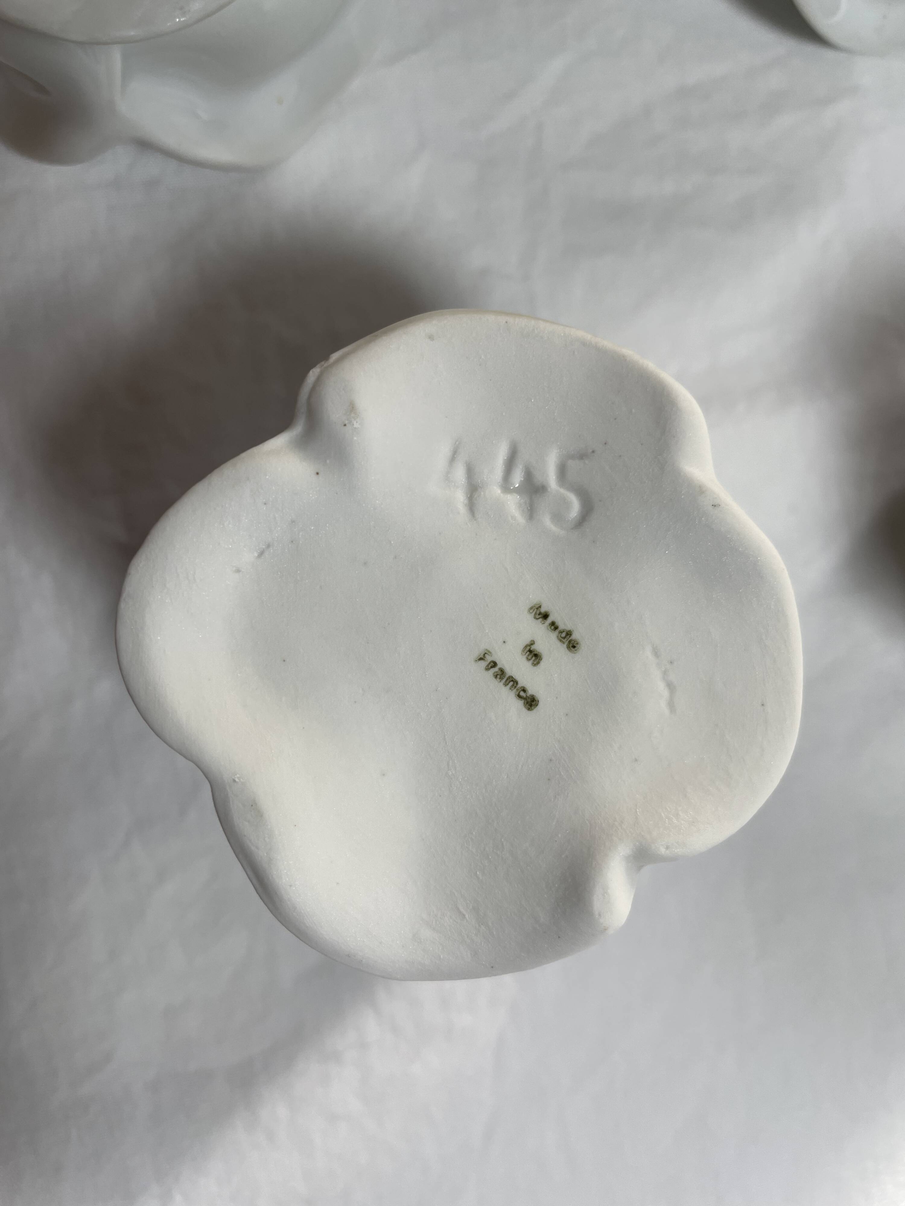 White porcelain rose shaped candle holders