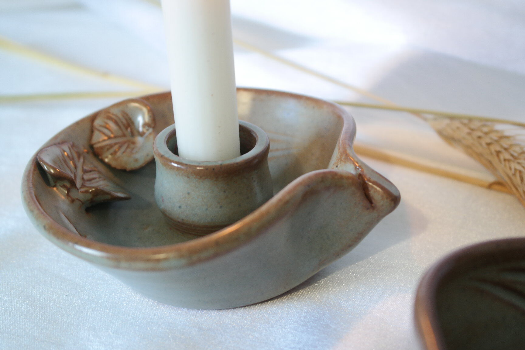 Pair of cellar rat candle holders in glazed sandstone