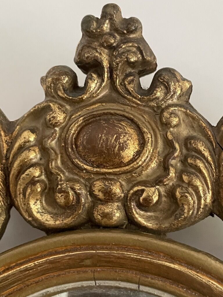 Old mirror in gilded wood